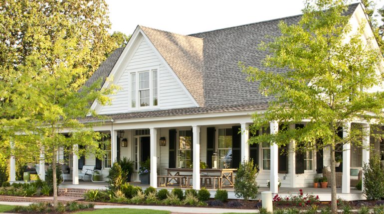 An American style white home with wrap around porch