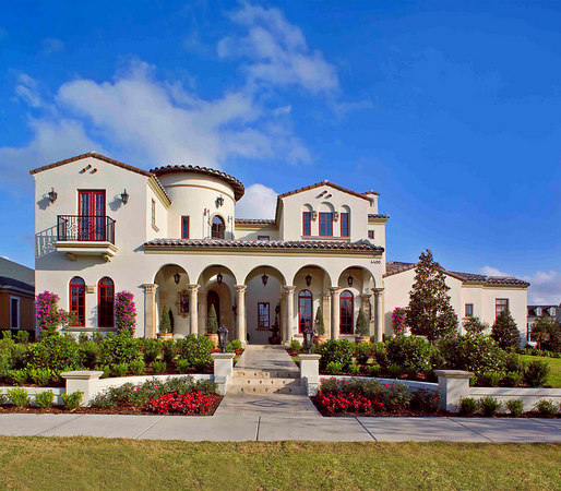Mediterranean style home with arched Phantom Screens.