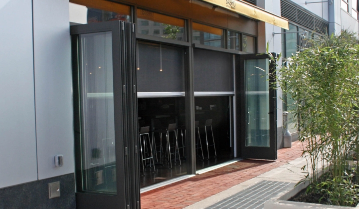 Restaurant patio screened in with Phantom motorized screens - keep the bugs out! 