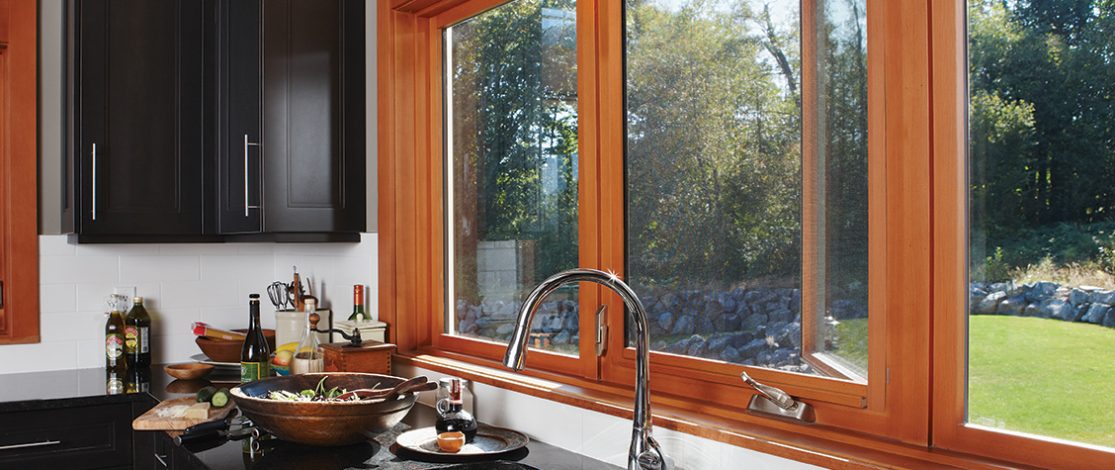 Disappearing window screens on wooden window over kitchen sink