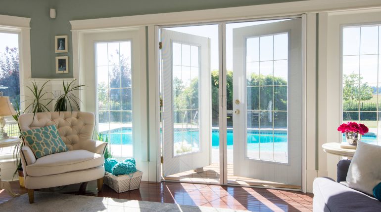 Looking out on to a pool through Phantom retractable screens