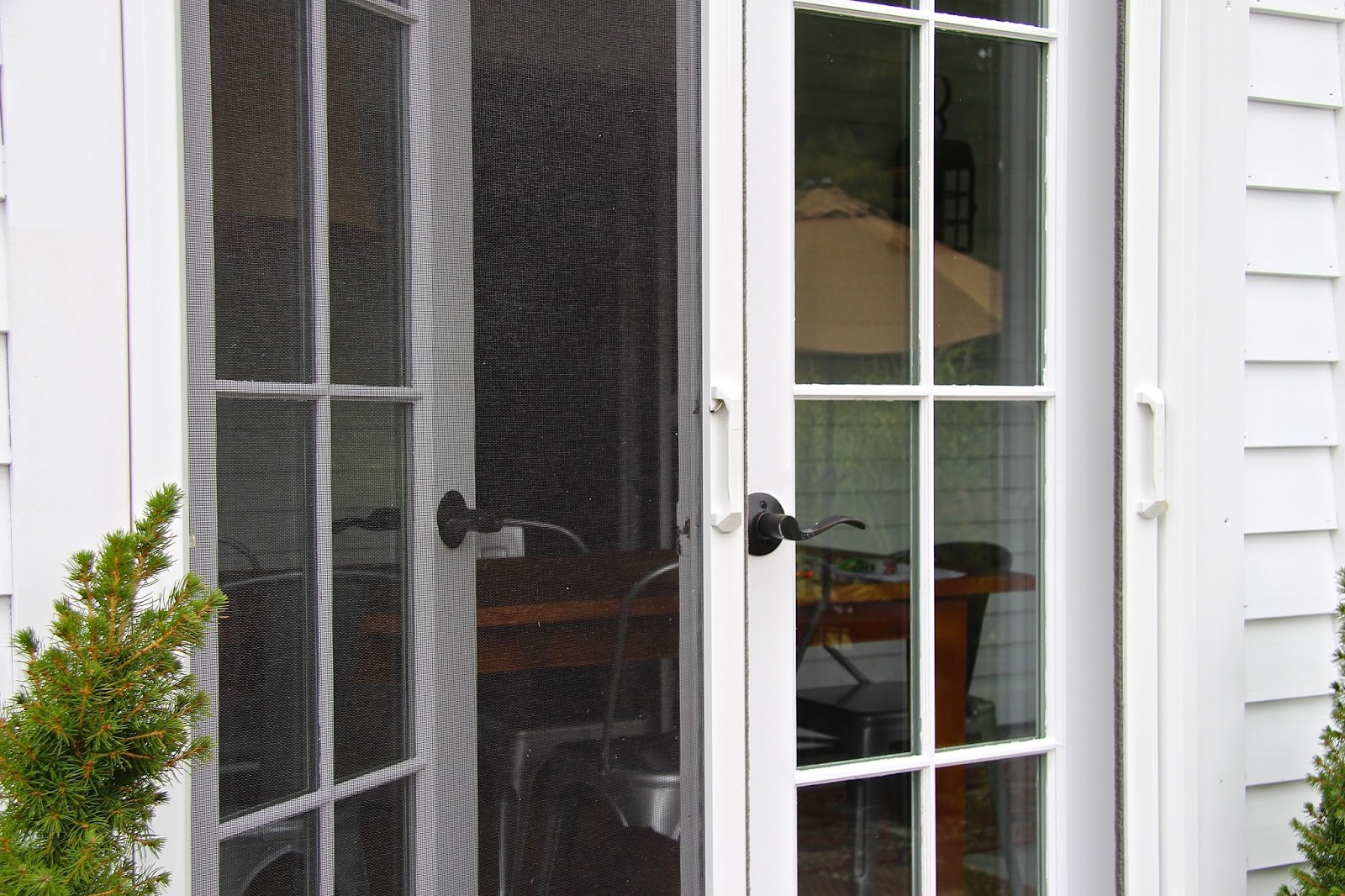 Close up of double doors with Phantom retractable screens